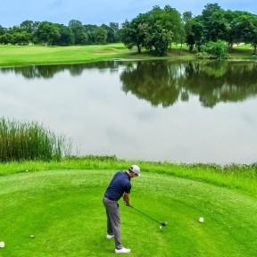 Man playing golf.